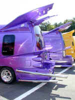 A heavily customized purple riced-out van